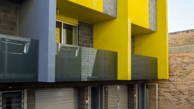 Student Living Edge Apartments – Cypress Street Building - featuring single car garage, telecom & balconies