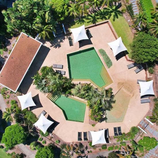 Aerial shot of lagoon pool with gardens surrounding at Pullman Magenta Shores