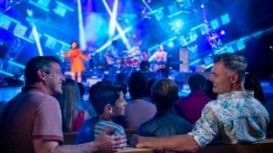 Group of people enjoy the Eat to the Beat concert series at the EPCOT International Flower & Garden Festival