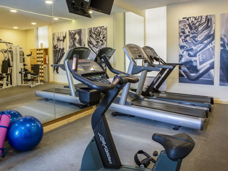 Close-up of treadmills & exercise bicycles in a gym, Fiesta Inn
