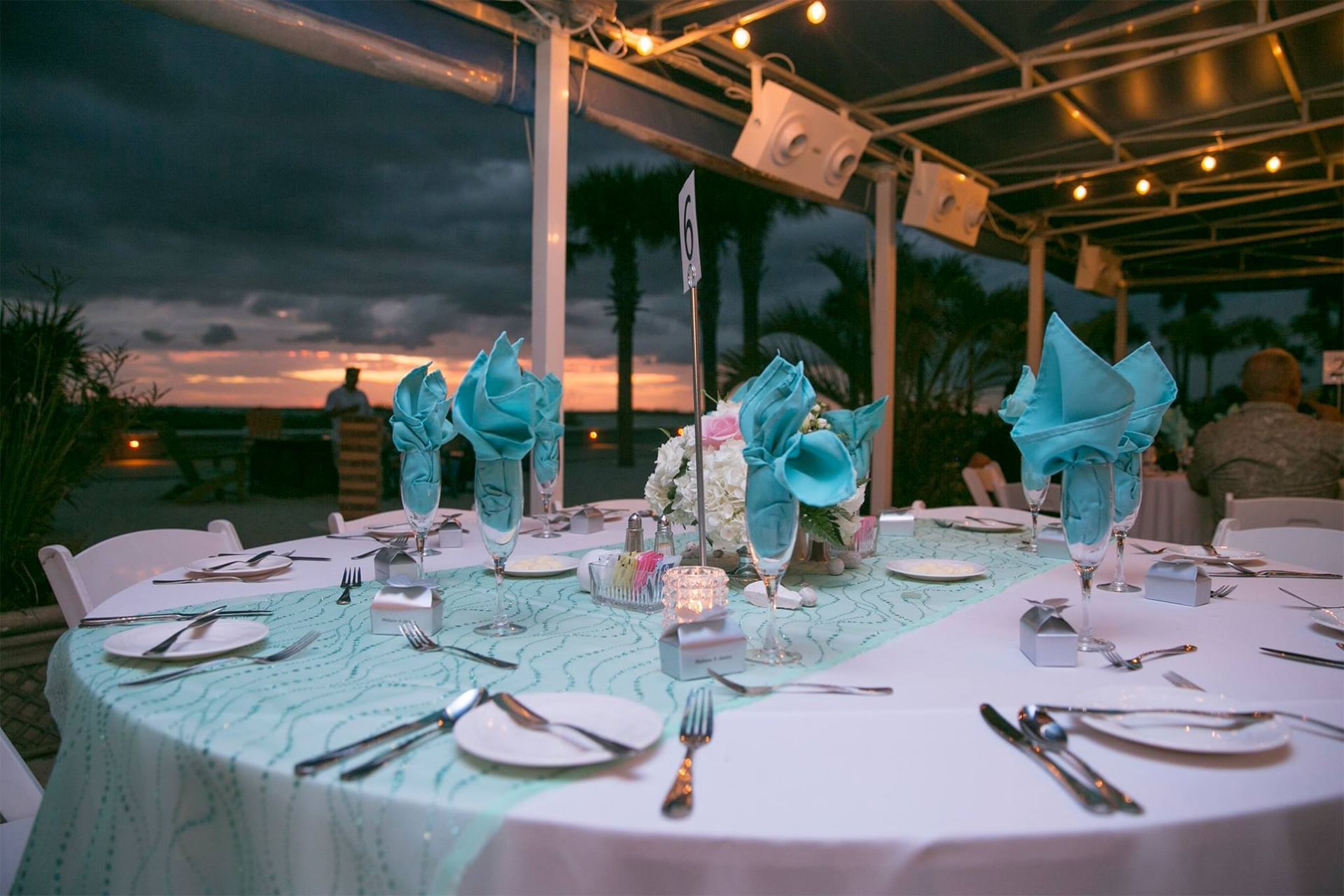 Banquet rounds arranged on a beach café at Bilmar Beach Resort