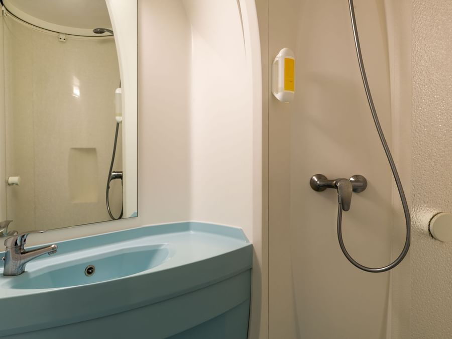 Bathroom vanity in bedrooms at Hotel Saint-Flour