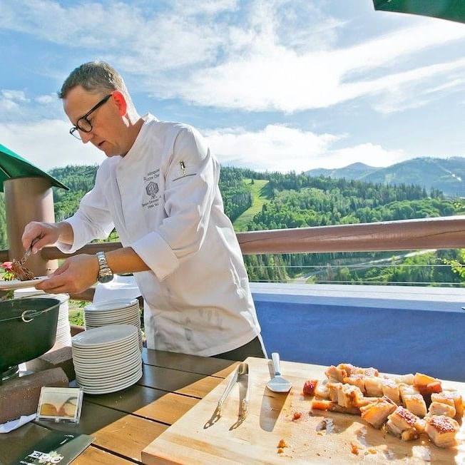 Chef serving food outside
