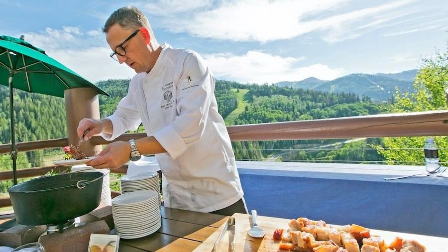 Chef serving food outside