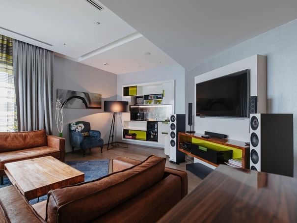 Living area with TV in Teufel Suite at Hotel Berlin Berlin