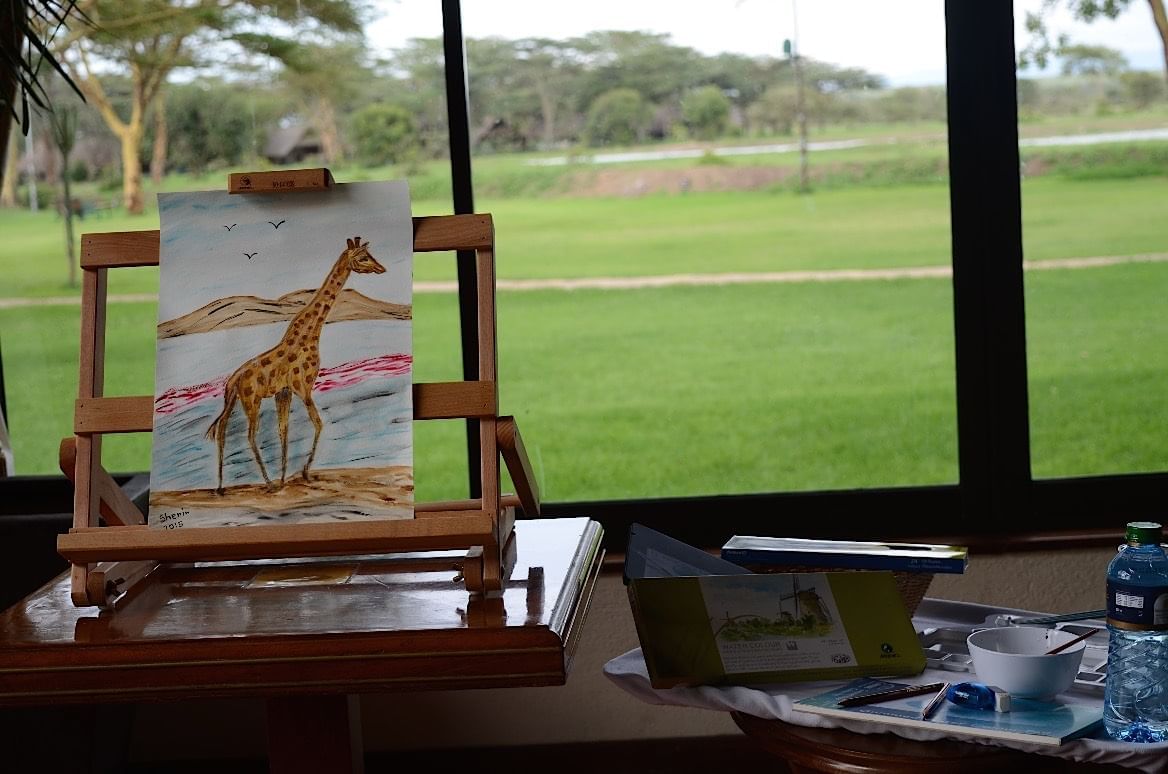 A Painting of a giraffe at Sweetwaters Serena Camp