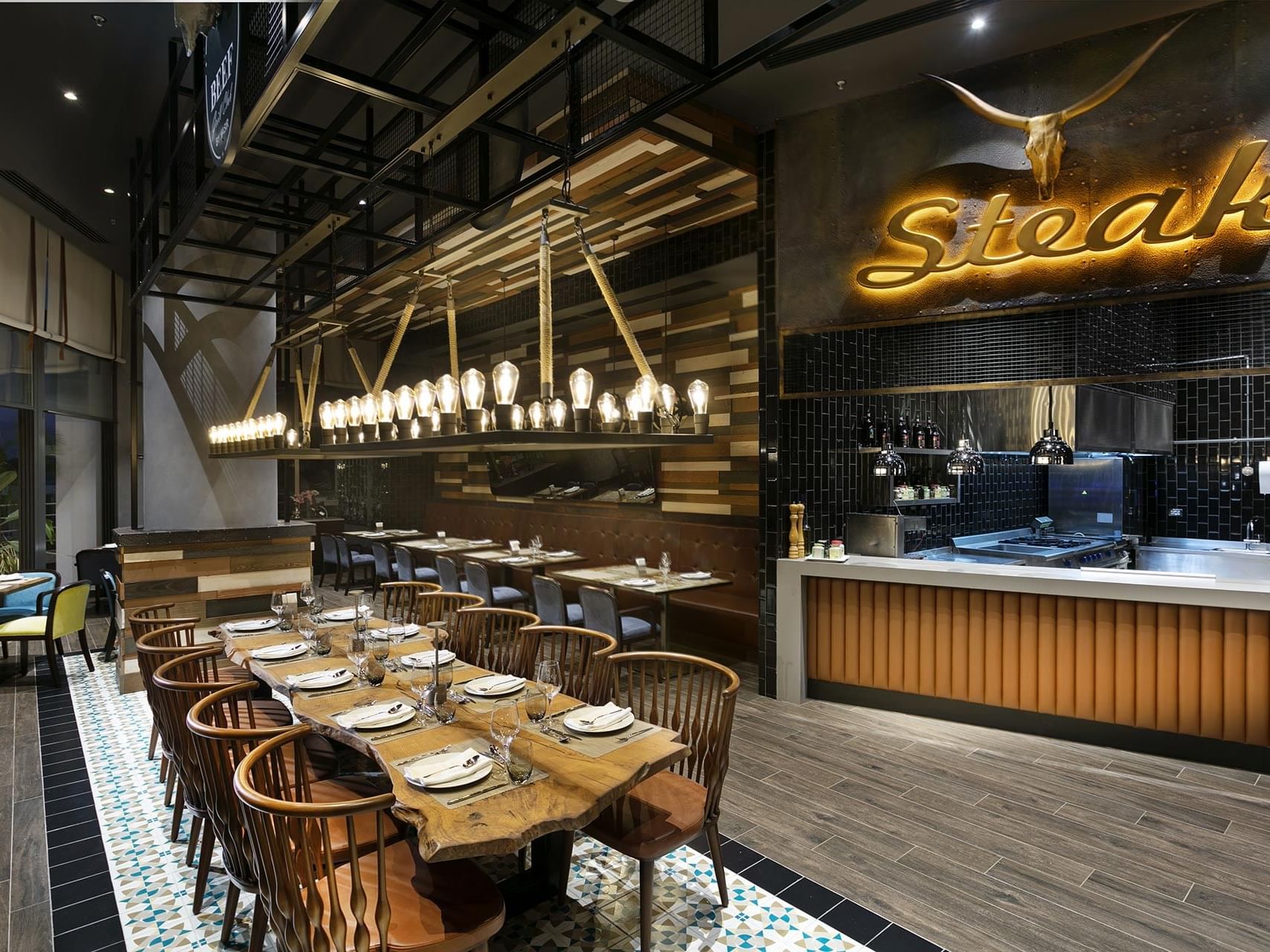 Interior of dining hall with seating area in Beef Grill Club at Titanic Deluxe Lara