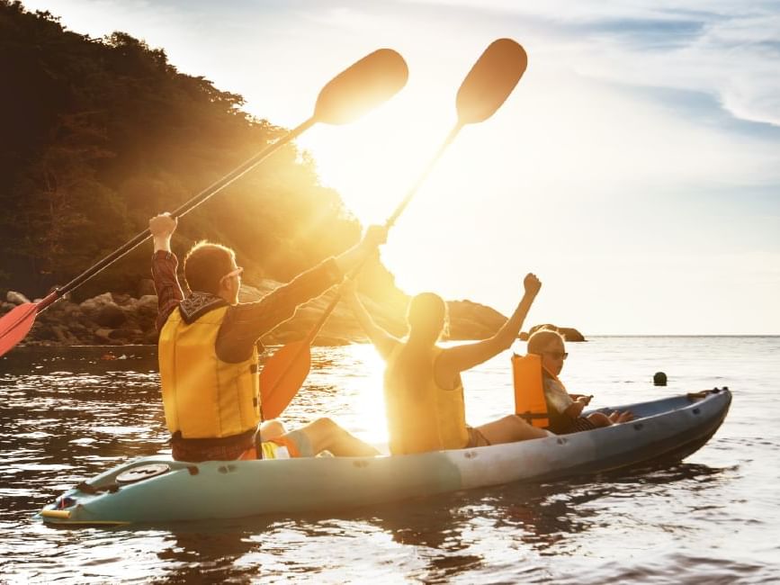family rowing on the water