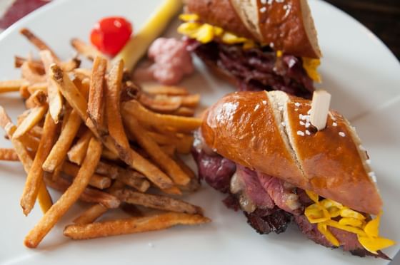 A plate with a sandwich and fries served at Stein Eriksen Lodge