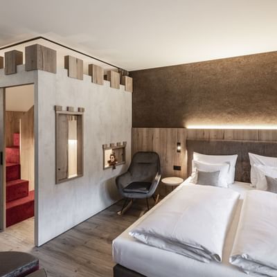 Large bed in Family Castle Room Lido at Falkensteiner Hotels