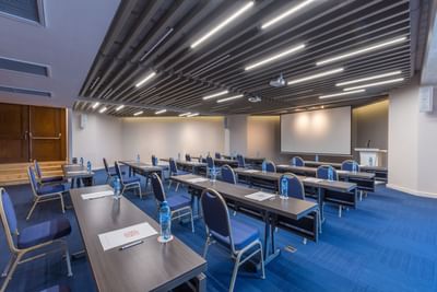 Classroom-style table set up in a meeting room at Villa Premiere Boutique Hotel & Romantic Getaway