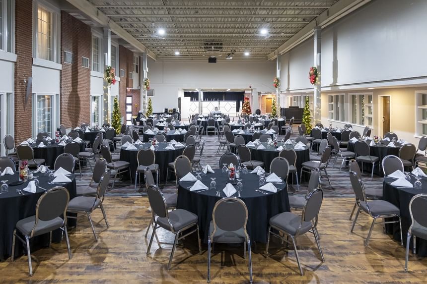 Large event space set with round tables and chairs, ready for Charlottetown, PEI events at Rodd Royalty