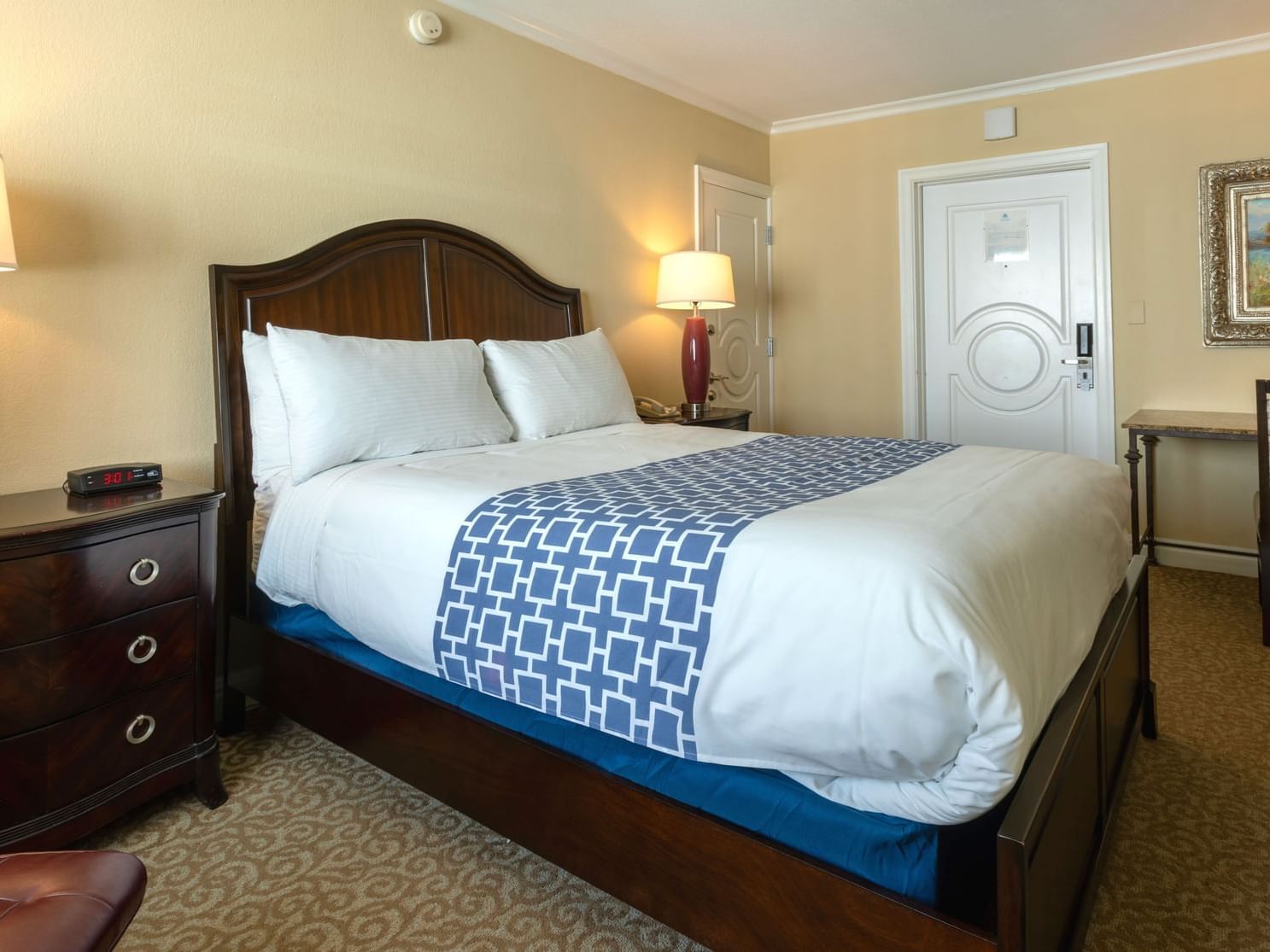 1 Queen Bed Room with nightstand at the Safety Harbor Resort & Spa in Tampa Bay, FL.