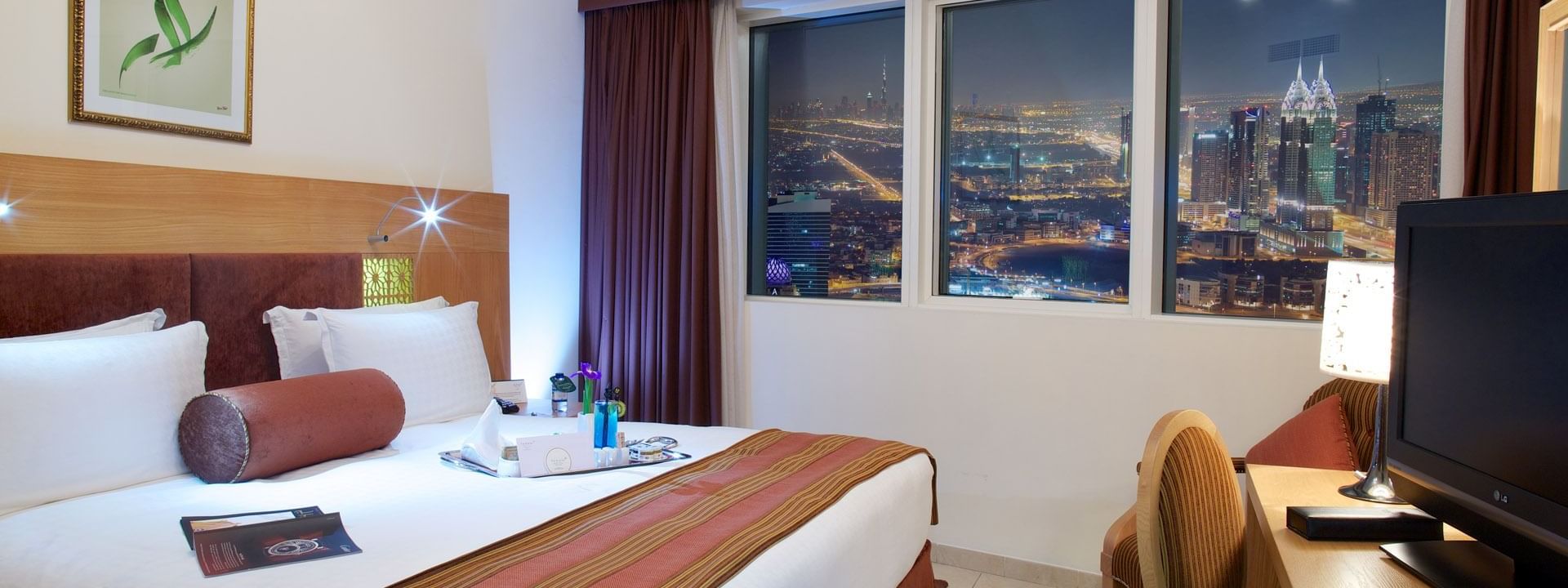 Two bed room suite with one king bed at Tamani Marina Hotel