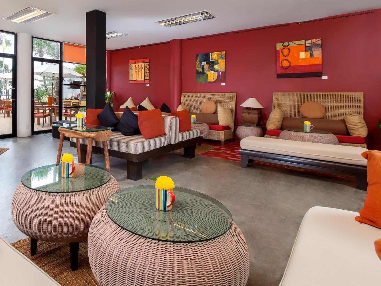 Lounge area with poufs at Café studio in Paradox Phuket Resort