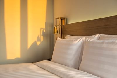 Close-up of comfy bed in Junior Suite at Eastin Ashta Resort Canggu