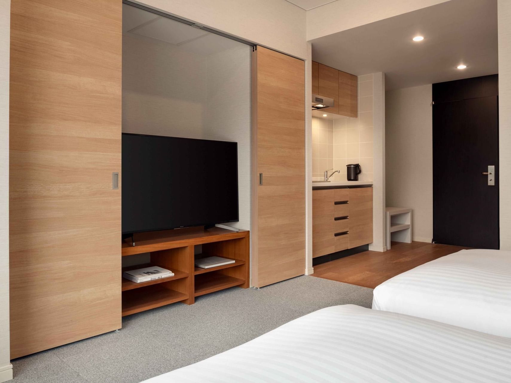 Bedroom with TV in Studio Room at Chatrium Niseko Japan