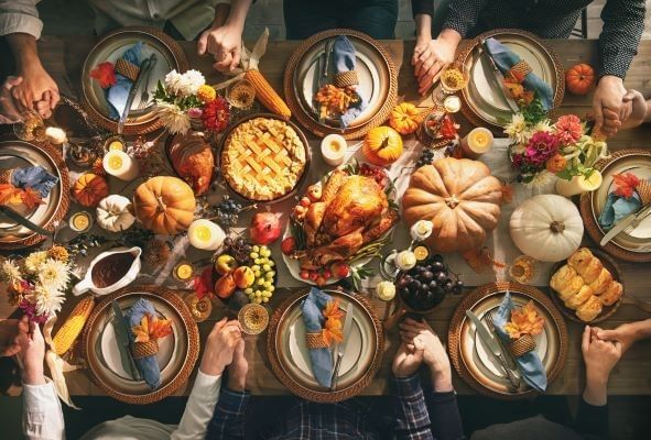 People sitting together for Thanksgiving dinner