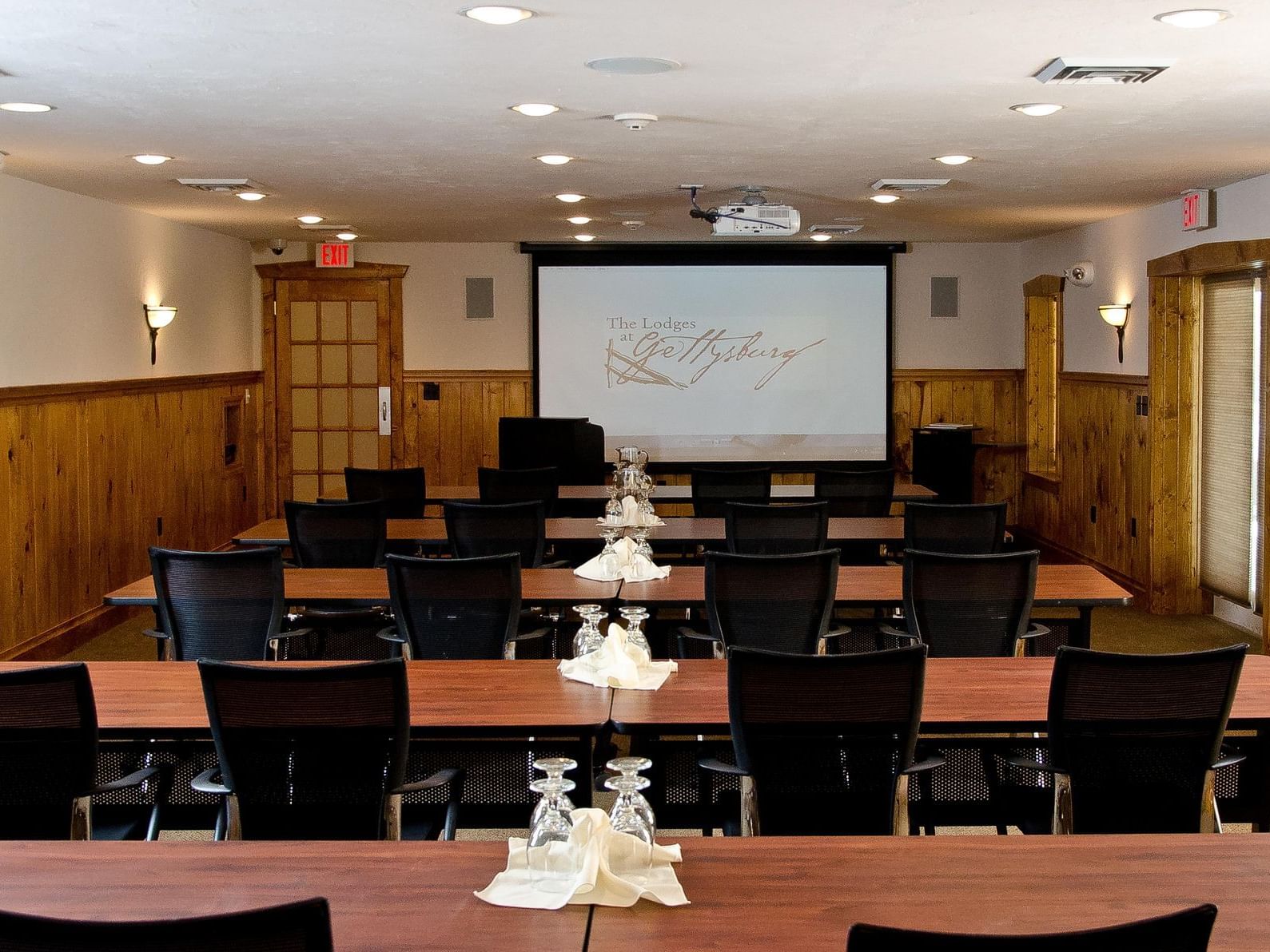 conference room with chairs and screen