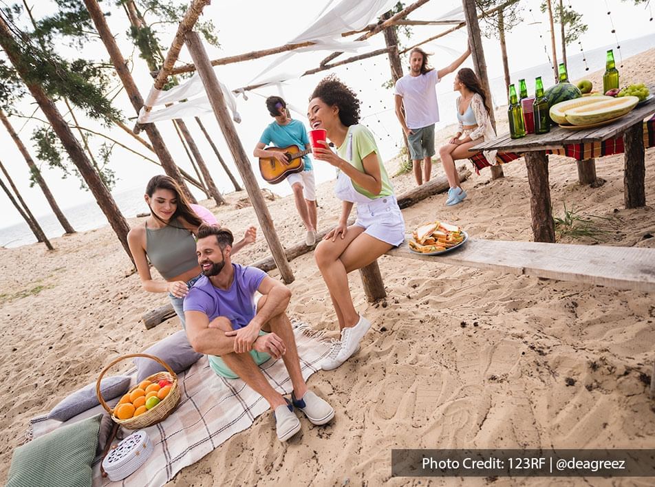 A group of friends spend good and fun time on the beach