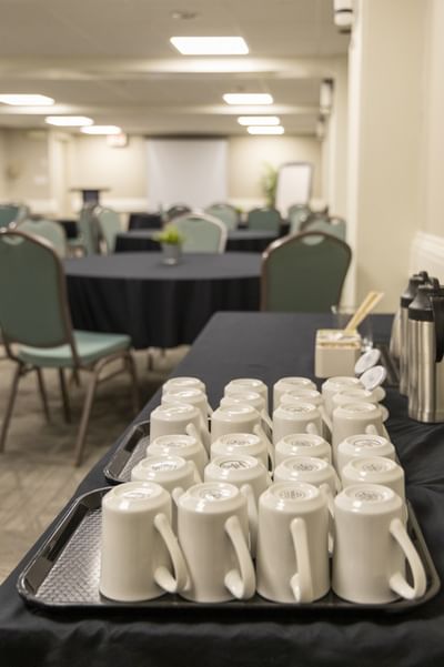 Coffee mugs neatly organized for guests looking for the best breakfast in Moncton experience at Rodd Moncton
