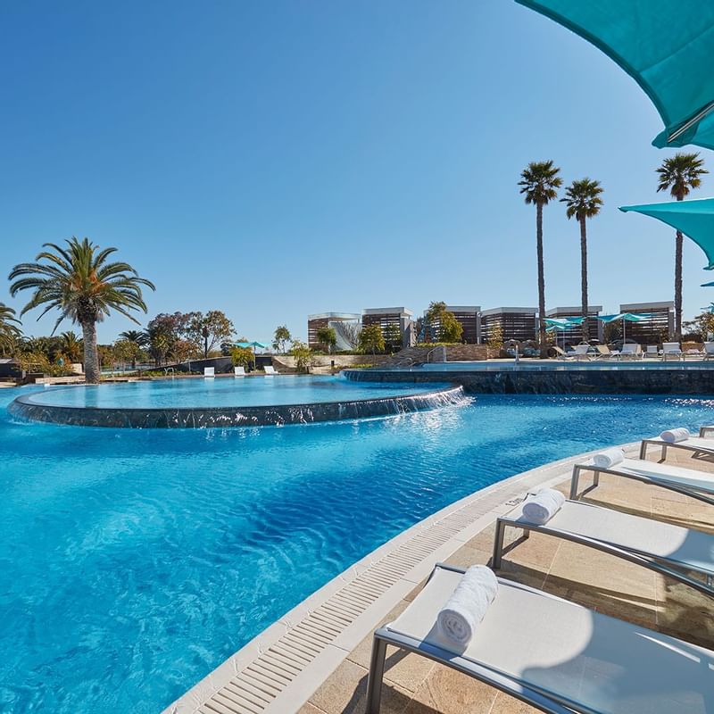 Close-up on the sun beds by the outdoor pool at Crown Hotels