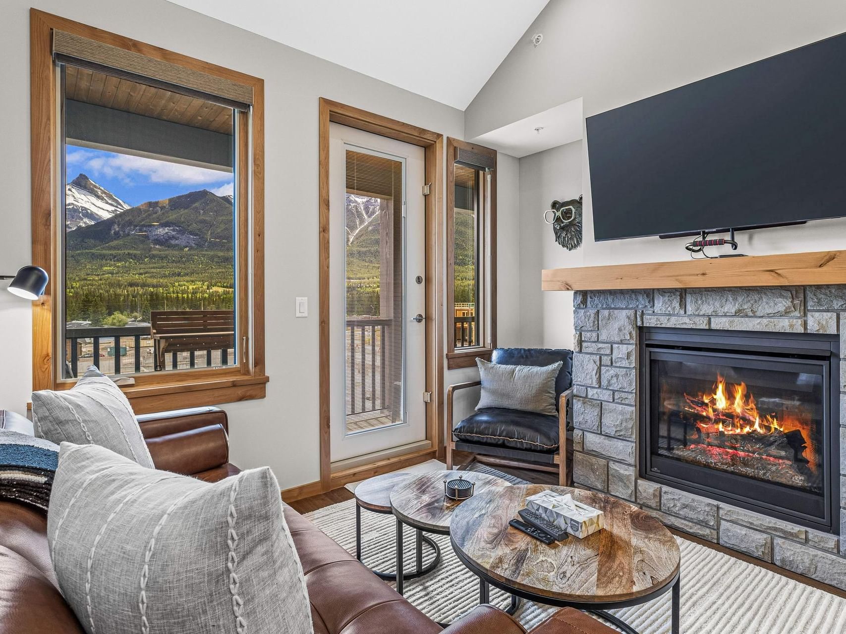 311 Timberstone Lodge One Bedroom Condo living area with a fireplace, and modern furnishings at Spring Creek Vacations