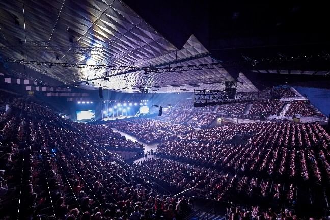 Large concert event at Vienna Stadthalle with illuminated stage and audience