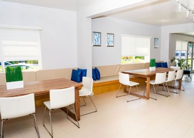 Seating arrangements in a lobby area at Aqua Hotel