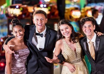 A group of young people smiling and posing for a photo at Amora Hotel Jamison Sydney