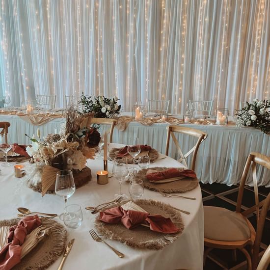 An elegantly decorated wedding reception table at Pullman Magenta Shores