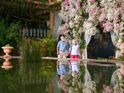 older couple looking at flower