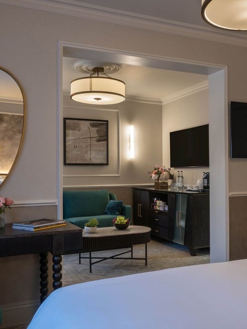 TV lounge with working desk and bed in Townhouse Junior Suite at The Capital Hotel, Apartments Townhouse