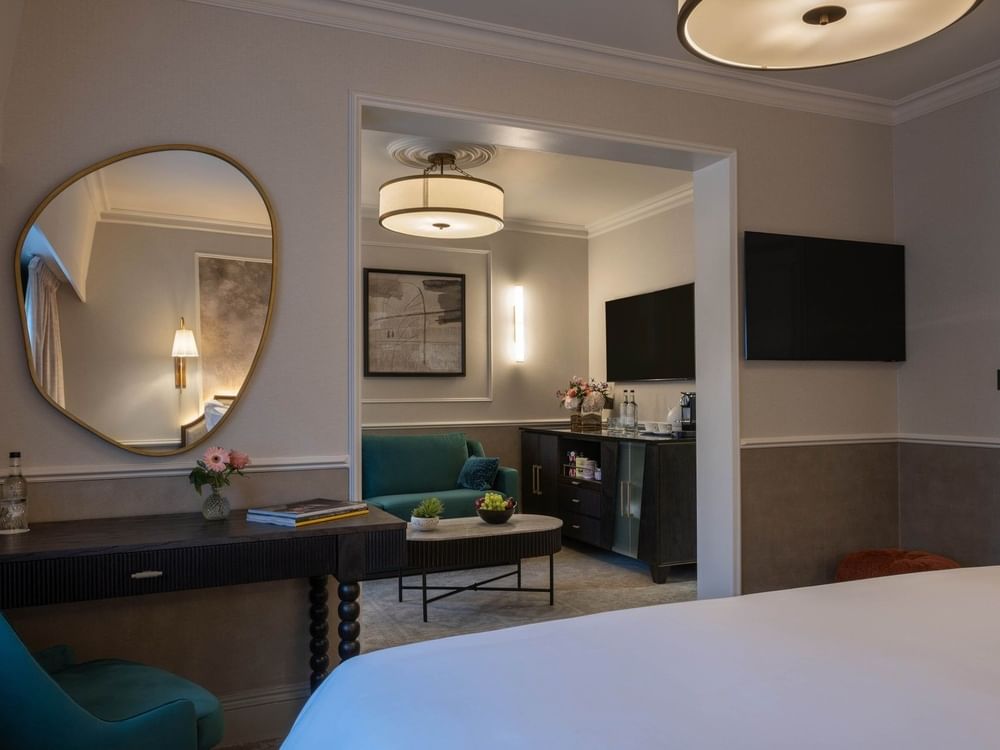 A luxurious suite at The Capital Hotel, Apartments & Townhouse in London with modern decor and elegant furniture