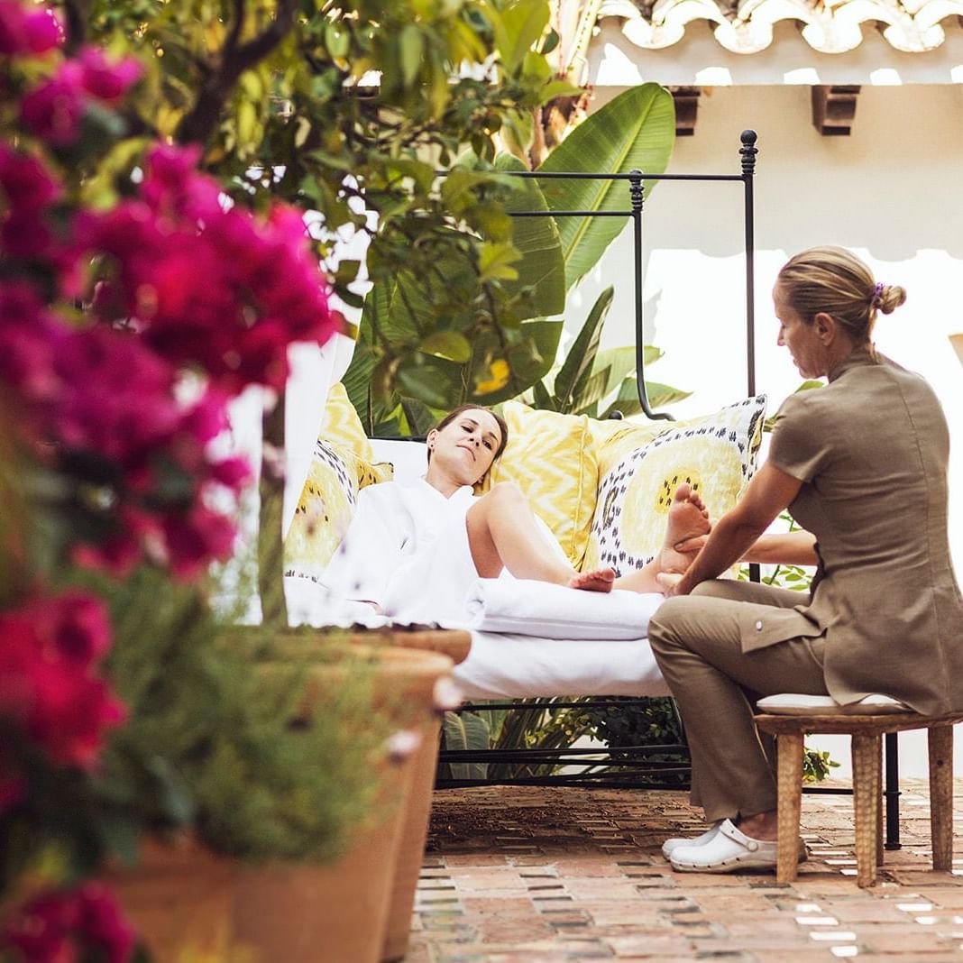 A lading receiving reflexology treatments at the Marbella Club