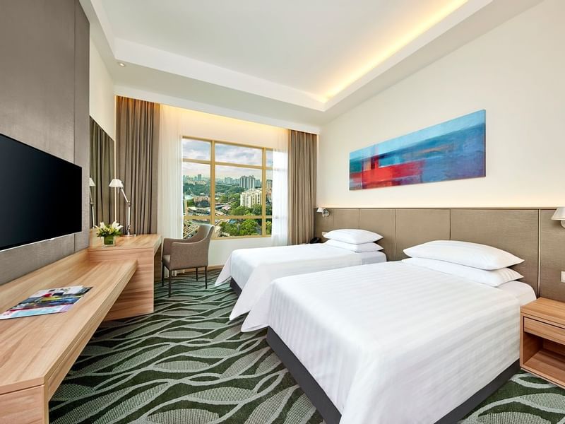 Tufted bed in Deluxe Plus King Room at Sunway Lagoon Hotel