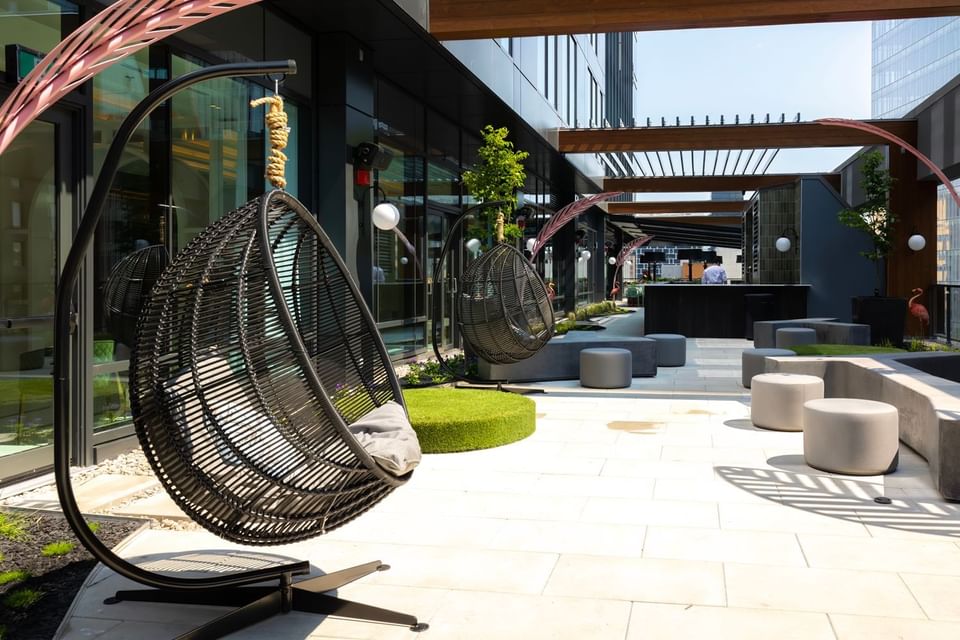 Egg hammock chairs in the lounge area at Muze Lounge & Terrasse
