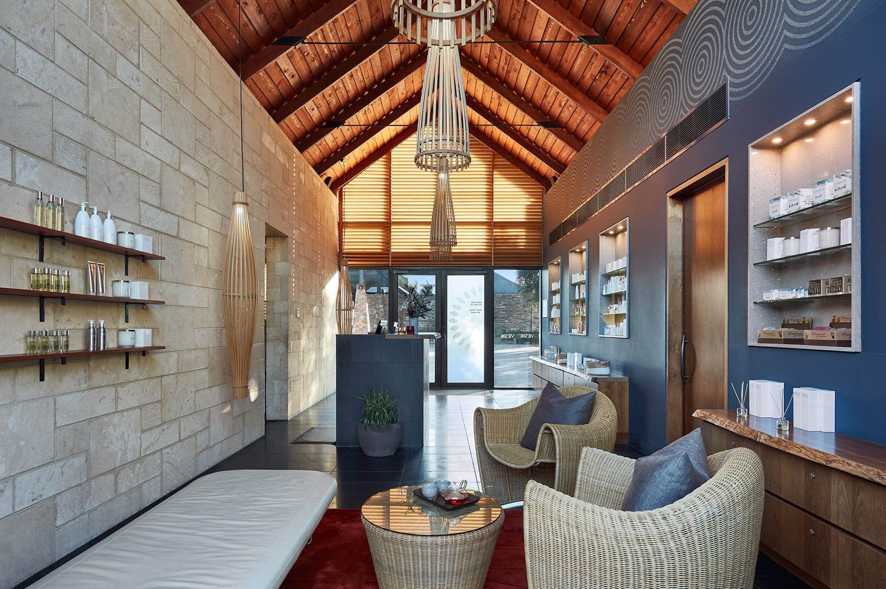 Interior of a spa lobby with sofa at Pullman Bunker Bay Resort