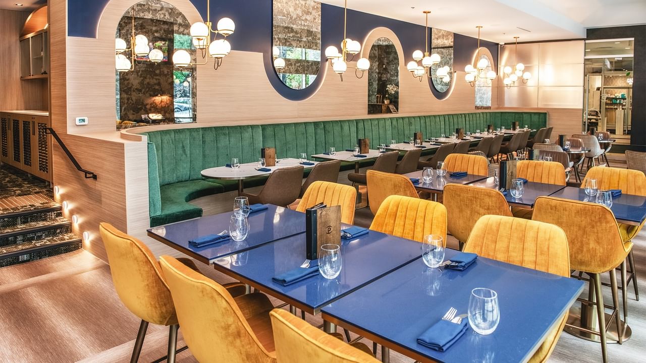 Restaurant with dining tables and chairs.