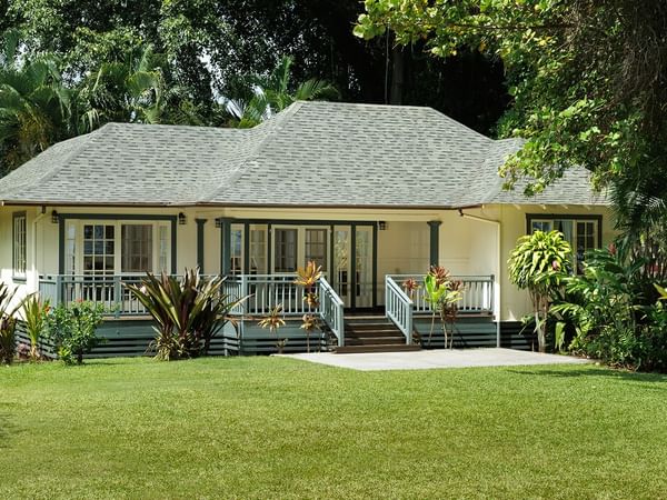 Waimea Plantation Cottages cottage exterior with trees and flowers
