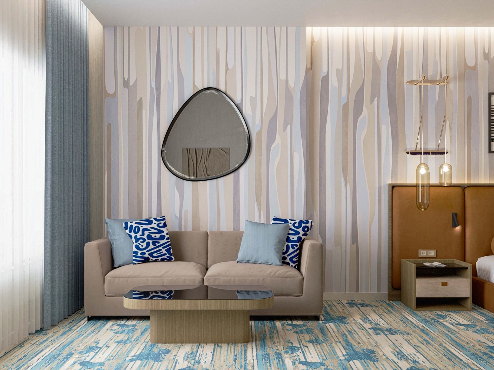 Beige sofas with blue patterned carpets under organic mirrors in suites at Warwick Jeddah Hotel & Spa