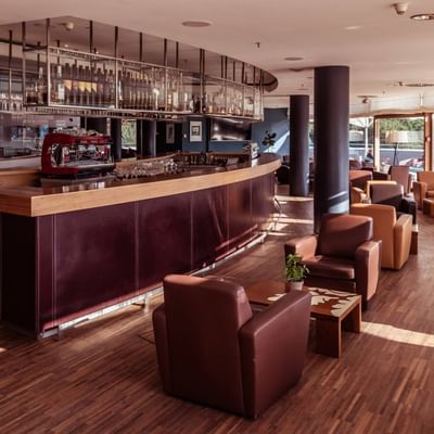 Atrium Bar counter & lounge area at Falkensteiner Hotels