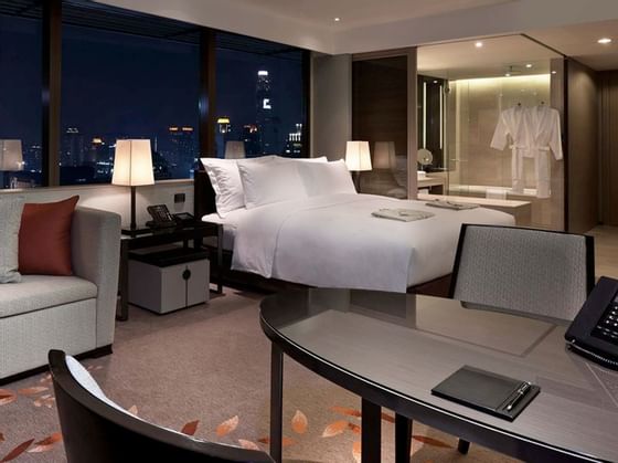 Interior of deluxe room with city view at The Okura Prestige