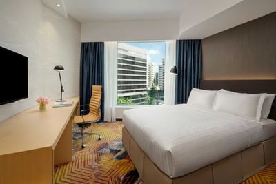 Premier Family Quadruple Room with a cozy bed and TV area at Park Hotel Hong Kong
