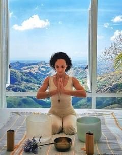 Lady doing yoga on a mat at Retreat Costa Rica