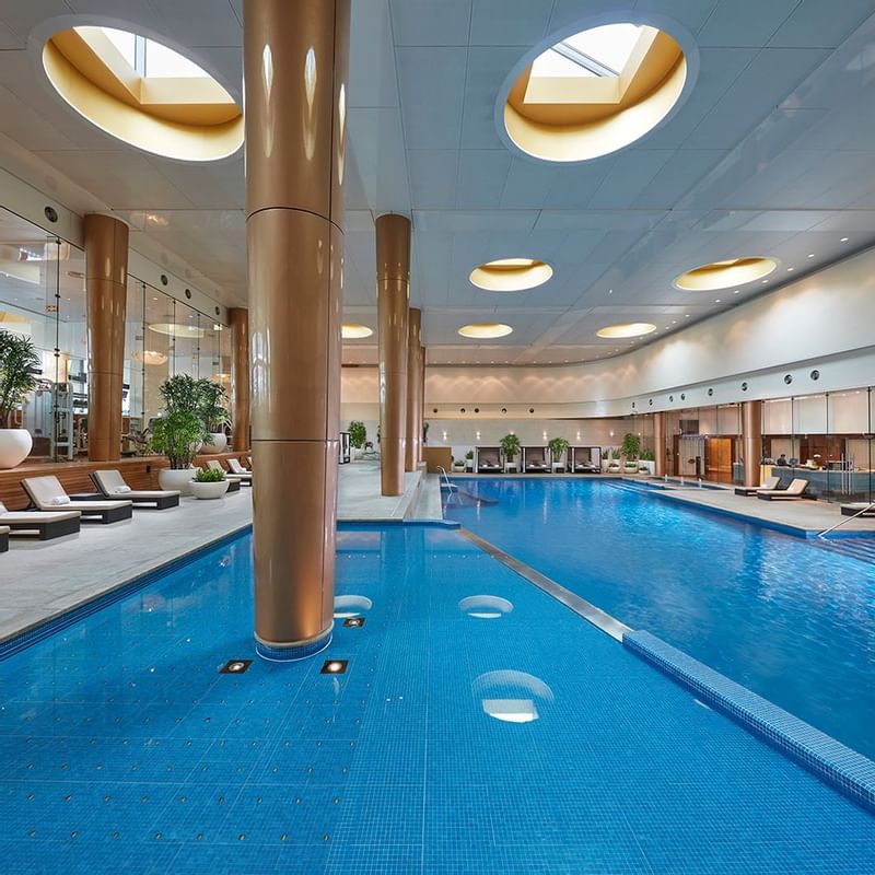 Indoor pool area with sunbeds at Crown Towers Melbourne