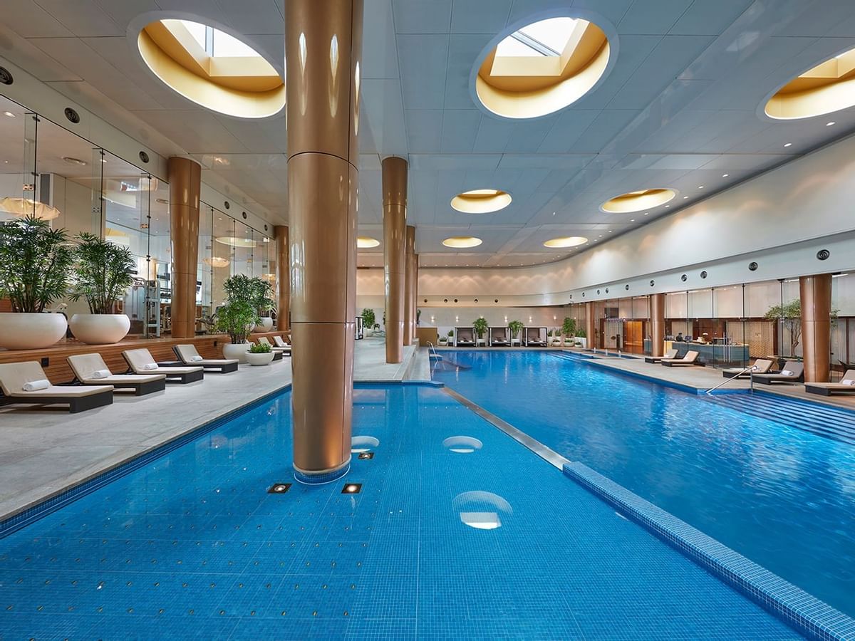Indoor pool area with sunbeds at Crown Towers Melbourne