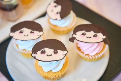 Cupcakes adorned with blue and pink toppers signify the exciting gender reveal at the Park Hotel Hong Kong