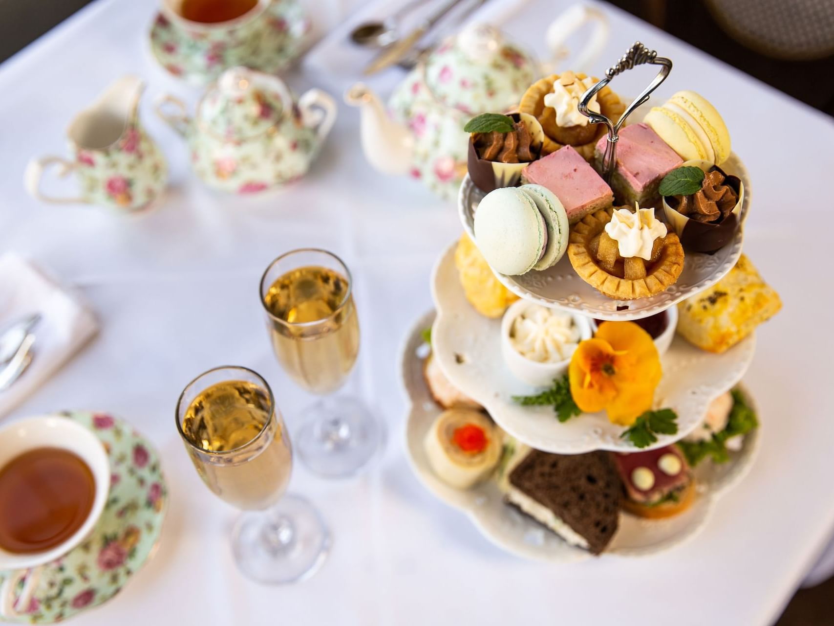 Spread of afternoon tea platter served with beverages in Pendray Tea House at Huntingdon Manor