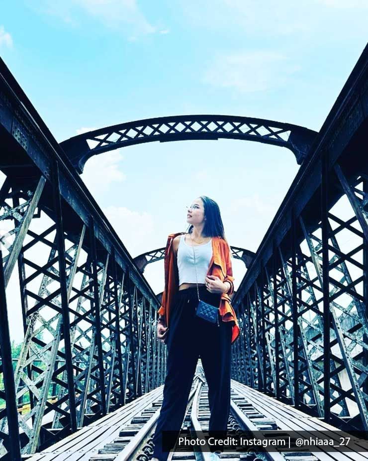 A young lady was striking a pose in front of the camera on the Ipoh Victoria Bridge - Lexis Suites Penang